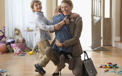 A picture of a mom coming home to her kids