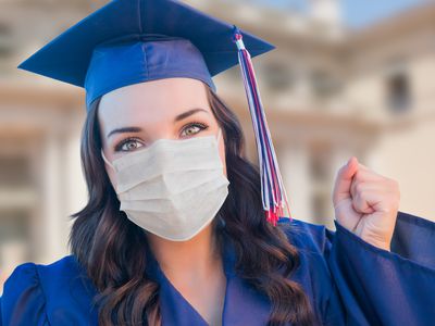 high school graduate wearing a mask