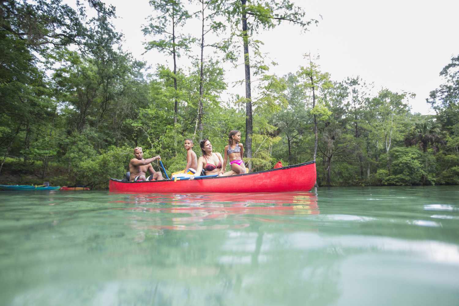 Family on a canoe trip together at Econfina Spring, Florida, USA
