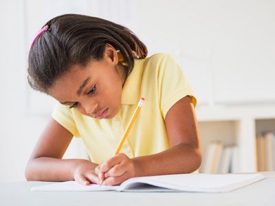 Young girl writing a biography
