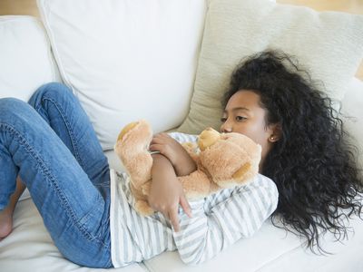 Girl holding a teddy bear