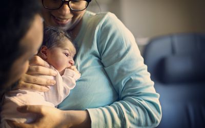 mother holding newborn baby