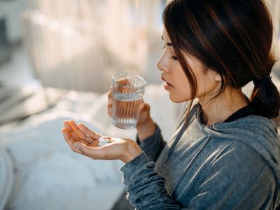 Woman taking pills