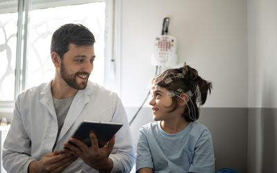 Doctor talking to a boy before polysomnography (sleep study)
