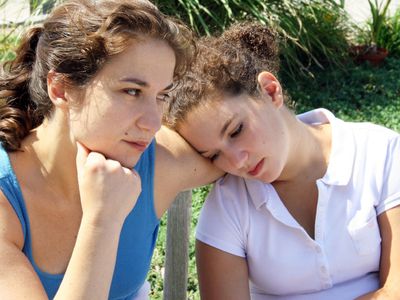 Mother and daughter looking sad