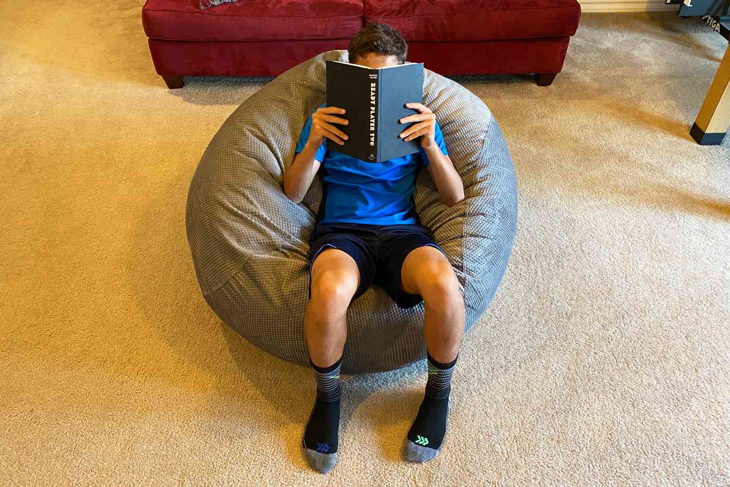 Boy reading in CordaRoy Chenille Bean Bag Chair