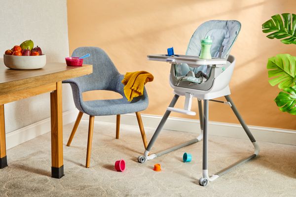 Ingenuity Beanstalk High Chair stands next to a chair