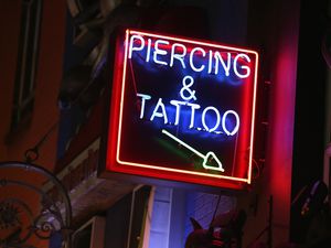 Can teenagers get a tattoo or a piercing without a parent's permission?
