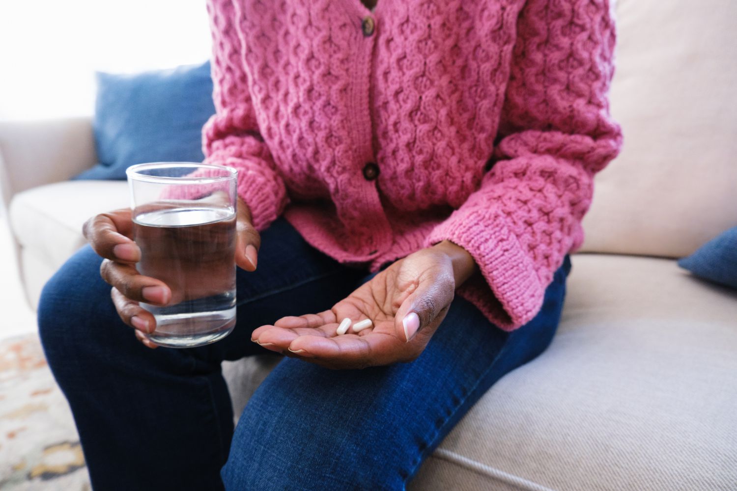 person holding pills