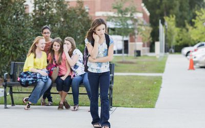 Girl being teased by other girls
