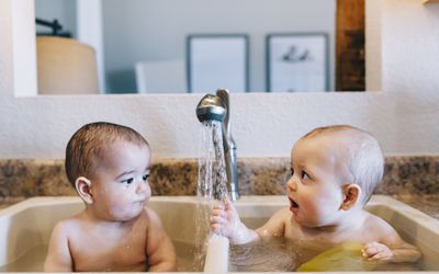 8 month Fraternal Twin Boys Bathe in a Sink