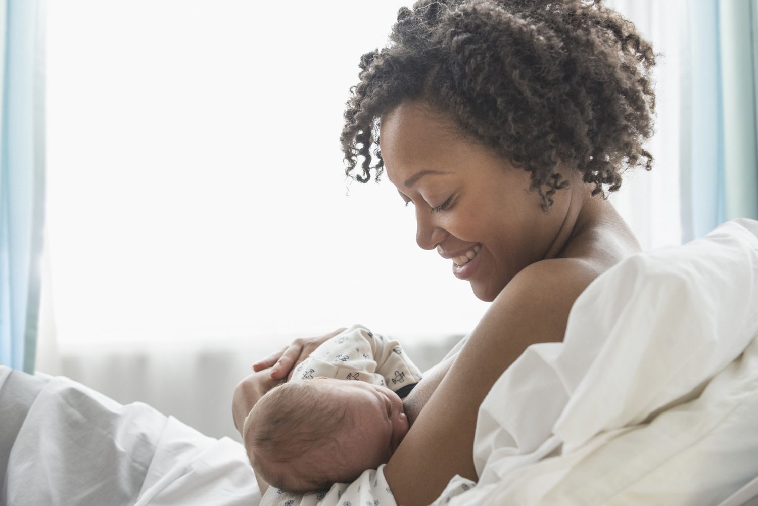 Mother nursing newborn baby
