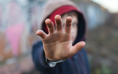 boy with his hand up