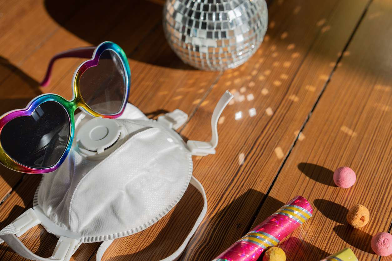N95 Mask on table with party supplies