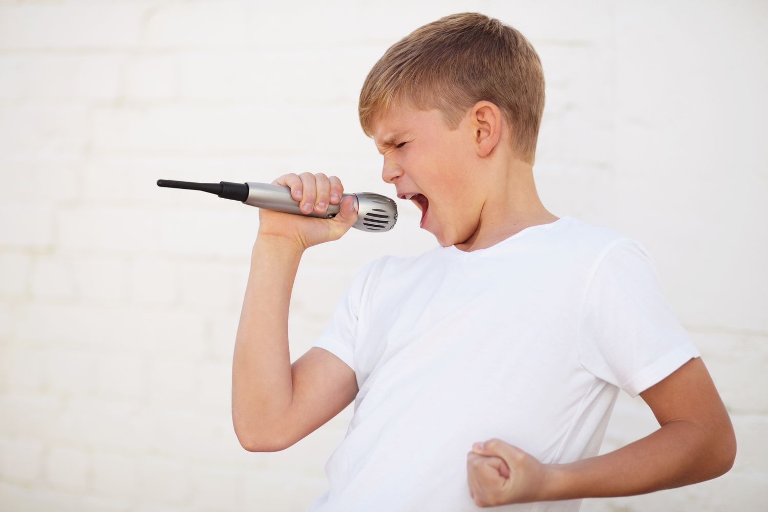 Boy singing with conviction