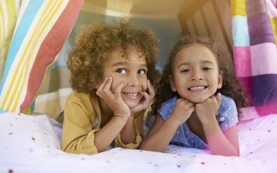 pretend play ideas - kids in a fort indoors