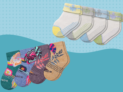 A variety of baby socks on a blue background