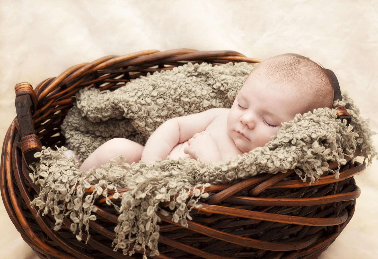Sleeping Newborn Baby in Basket