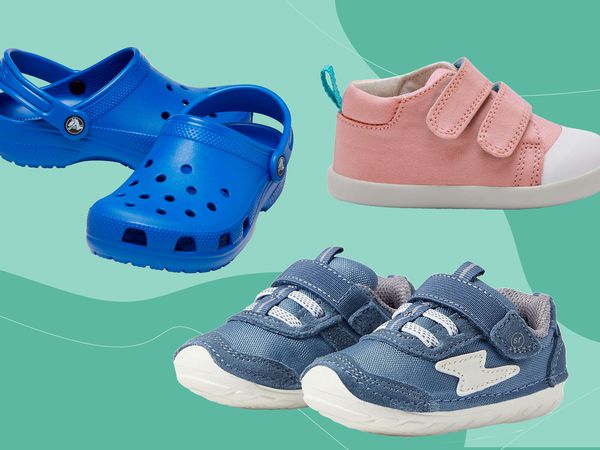 Three pairs of toddler shoes on a green background