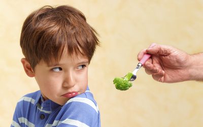 Boy Refusing to Eat His Vegetables