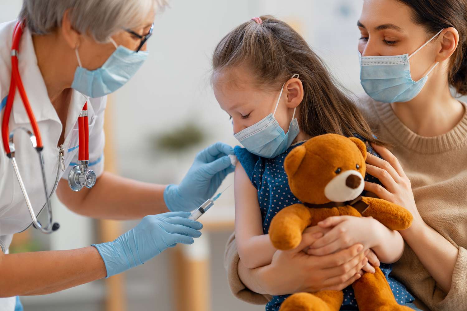 doctor vaccinating child