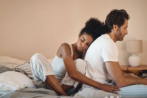 A couple comforts one another