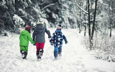 kids in coats and snow