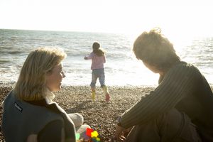 Couple on beach with child, secondary infertility preventing them from having another