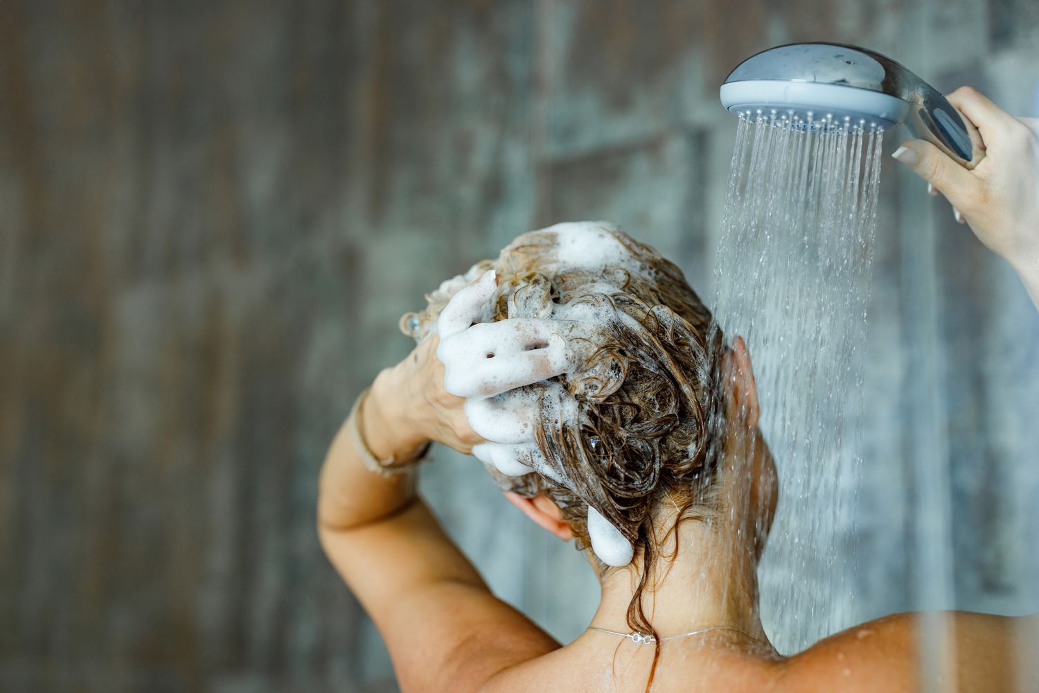 woman using shampoo