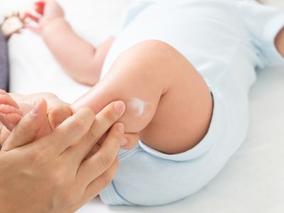 Applying sunscreen to baby