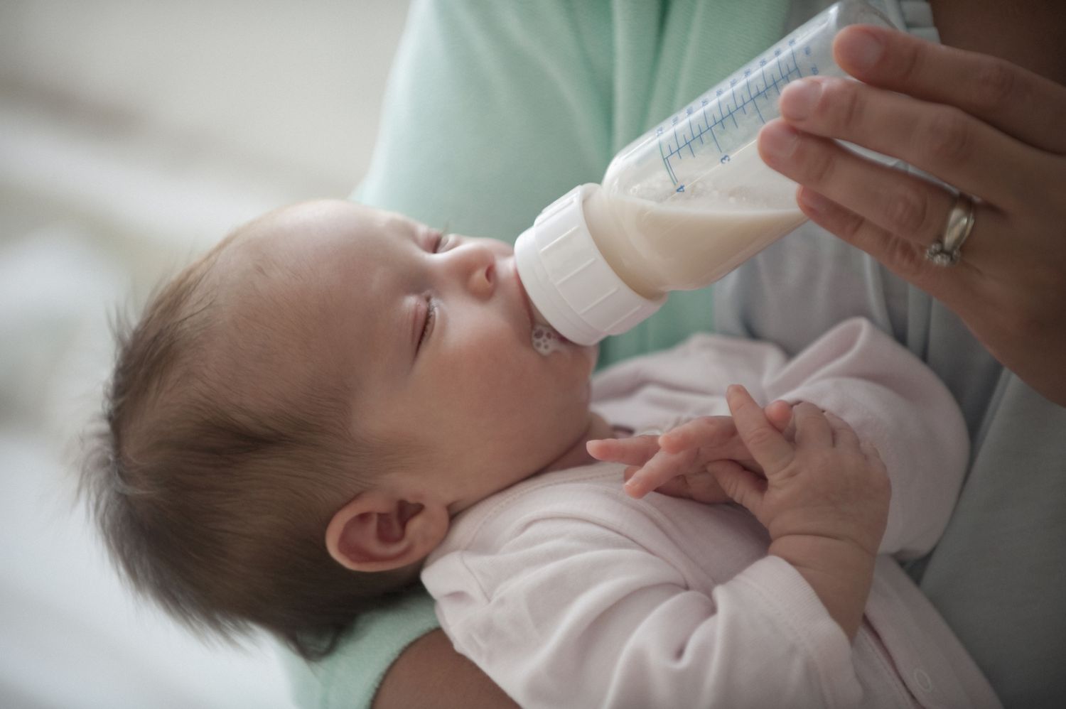 Latino, hispanic, mother feeding newborn baby girl