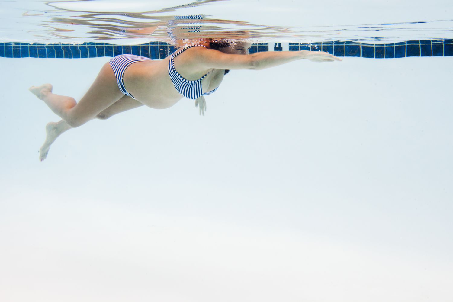Pregnant woman swimming