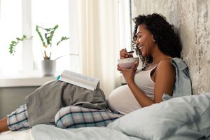 woman in bed eating
