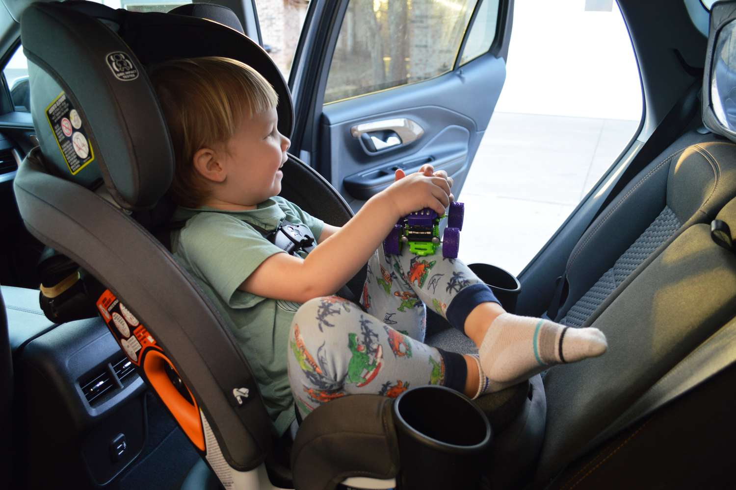 Child sitting in the Graco Turn2Me 3-in-1 Rotating Convertible Car Seat