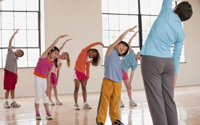 kids stretching in gym class