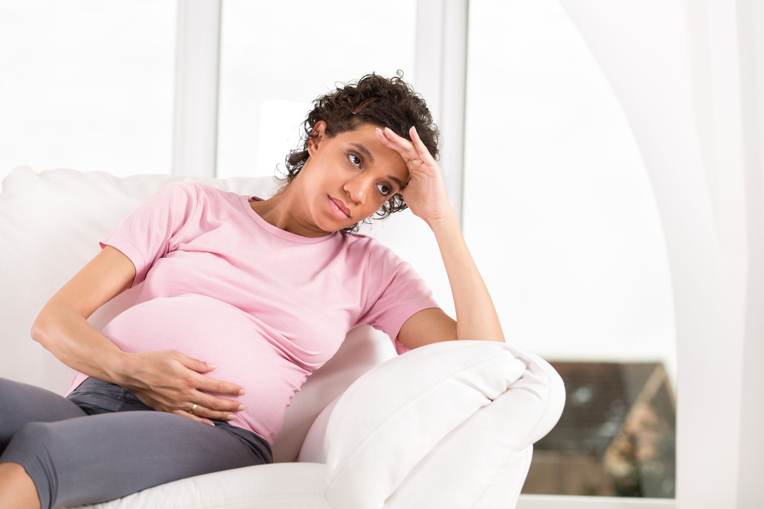 pregnant person with upset stomach