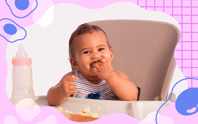 Baby eating eggs