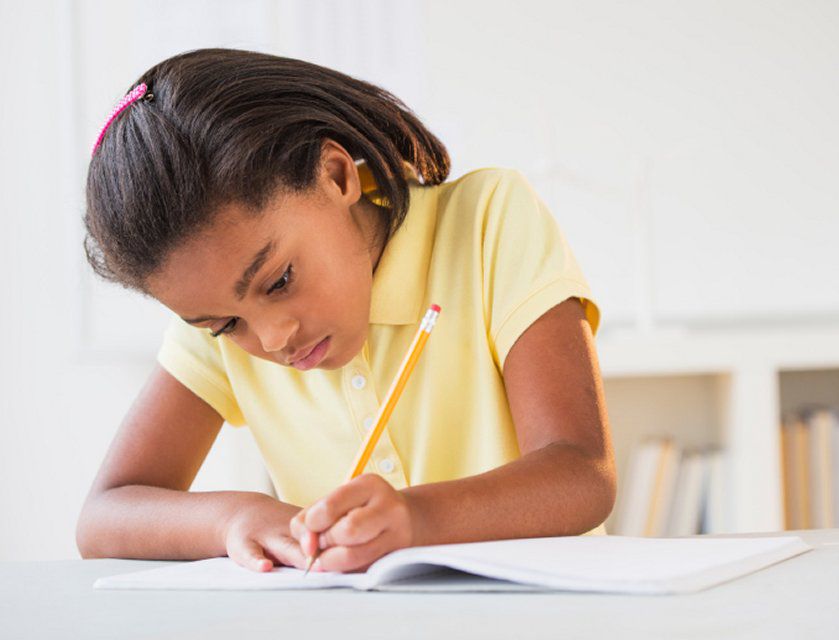 Young girl writing a biography