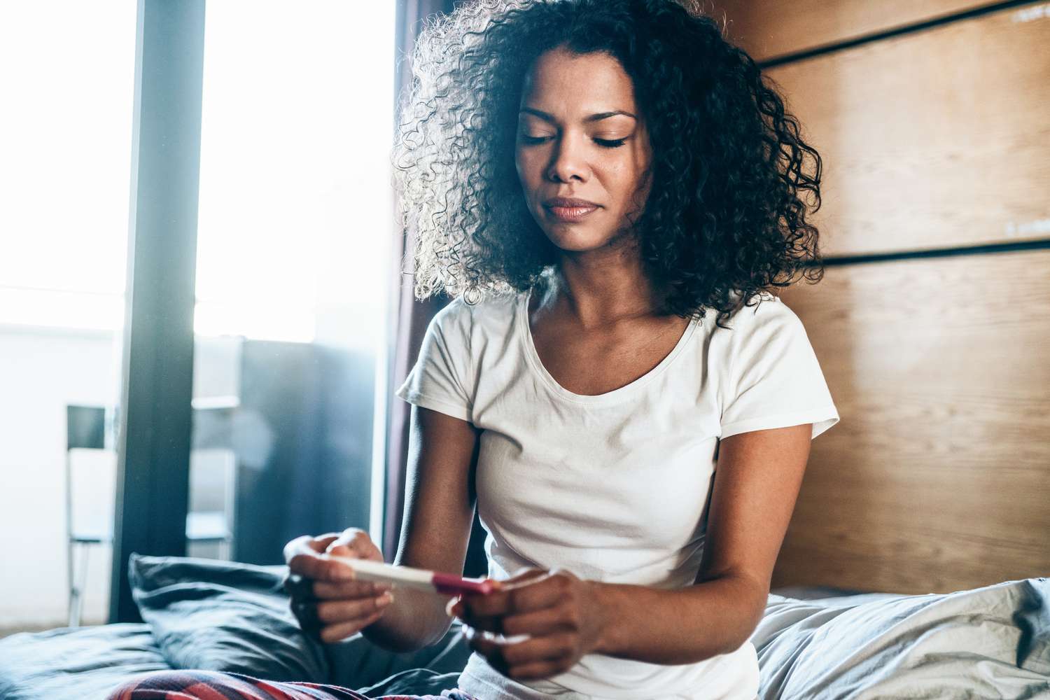 Woman reviewing pregnancy test results