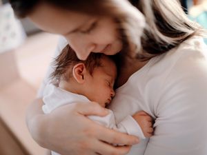 Mother holding newborn baby