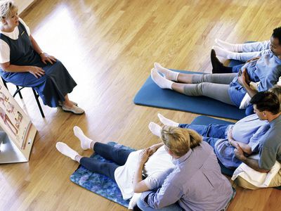 Husbands and their pregnant wives at a prenatal class