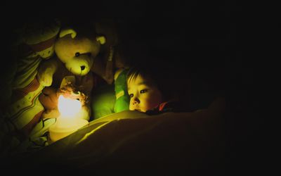 Child with night light