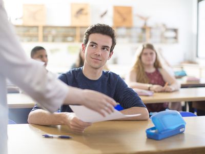 Smiling student receiving test results