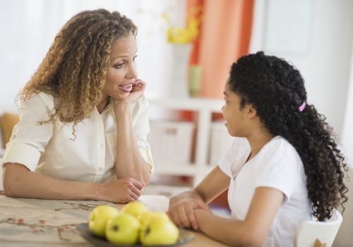 Mom talking to her daughter