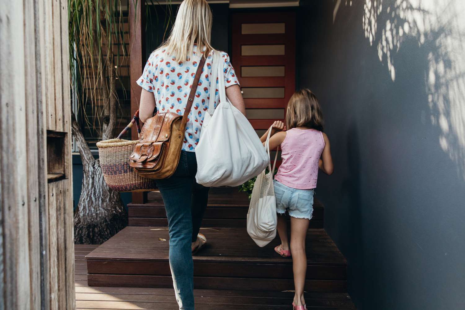 step mom and daughter walking up some stairs