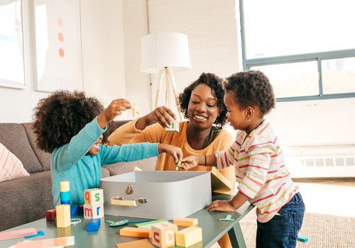 Babysitter playing with children