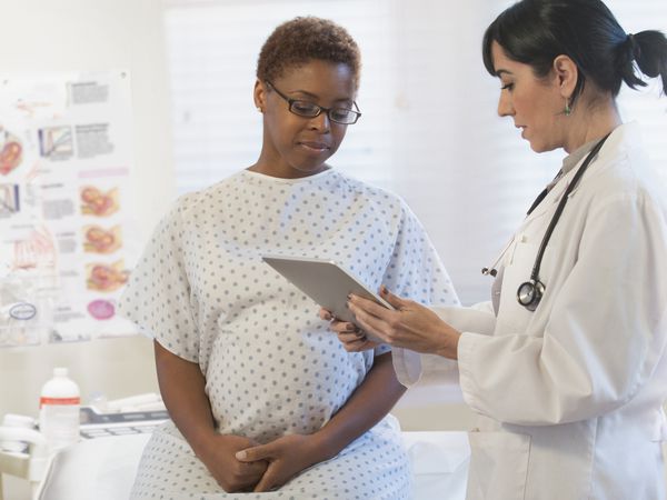 pregnant person with an OB/GYN