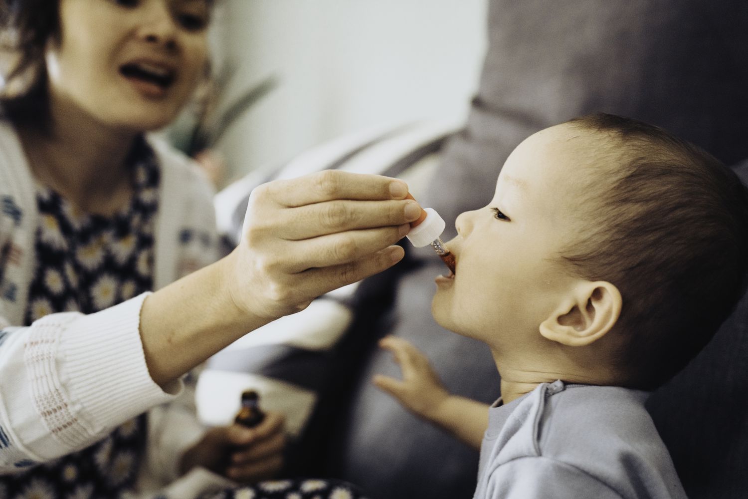 Child receives medication orally through a dropper