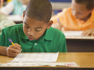 young boy taking test in school