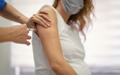 Pregnant woman receiving the covid-19 vaccine